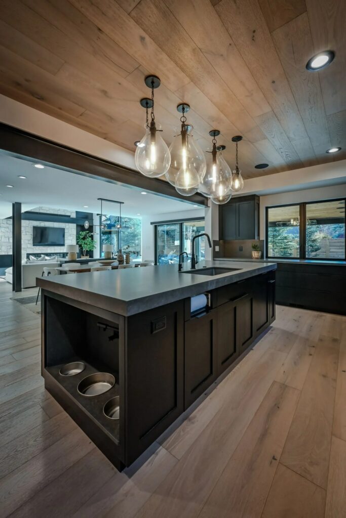 Custom built kitchen in Park City with open design, hardwood floors and countertop island with built in sink and pet dishes